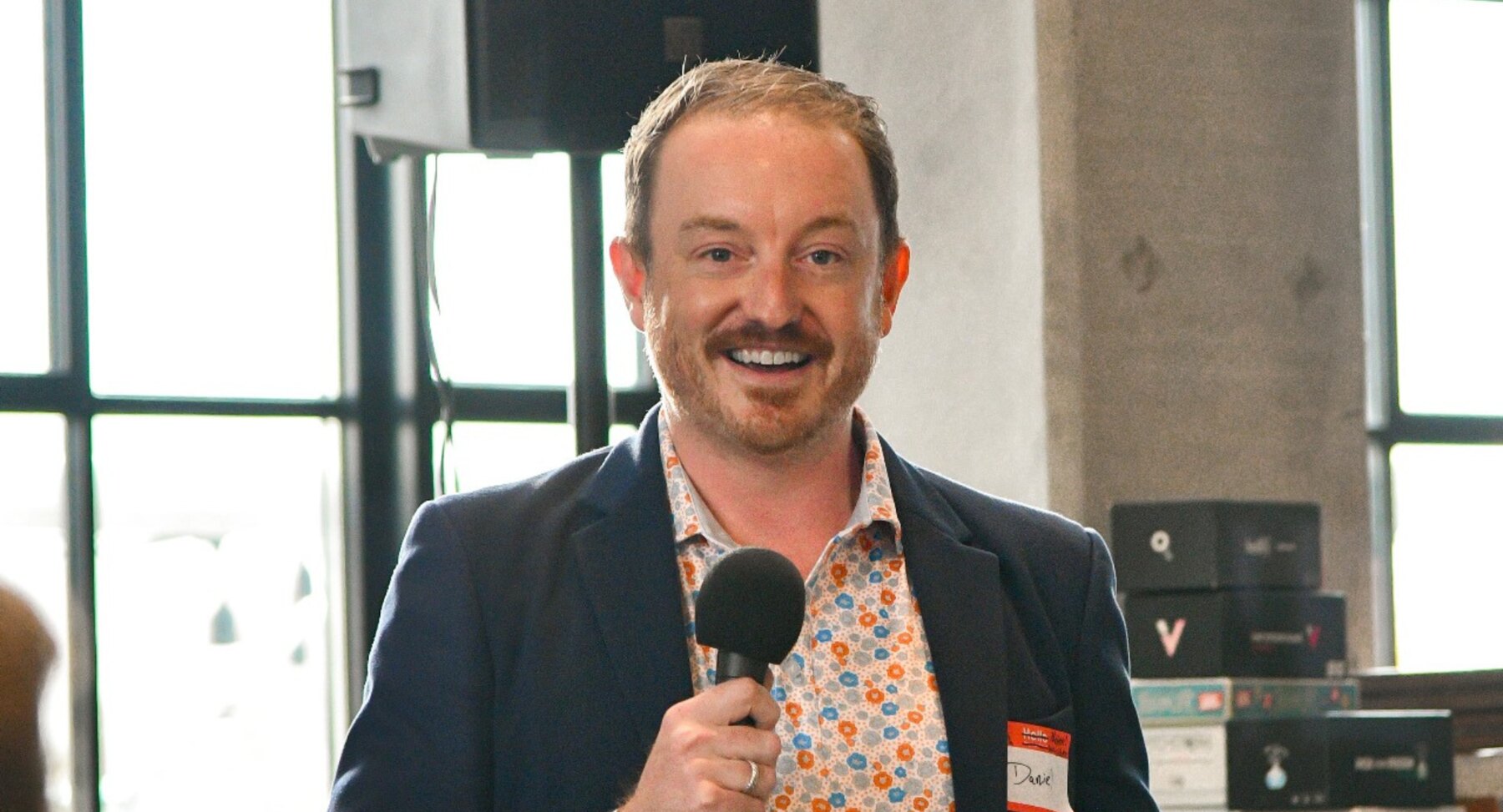 Daniel Atz speaking at a conference